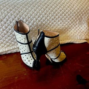 Fashion at its best theses white and black heeled semi boot back zipper